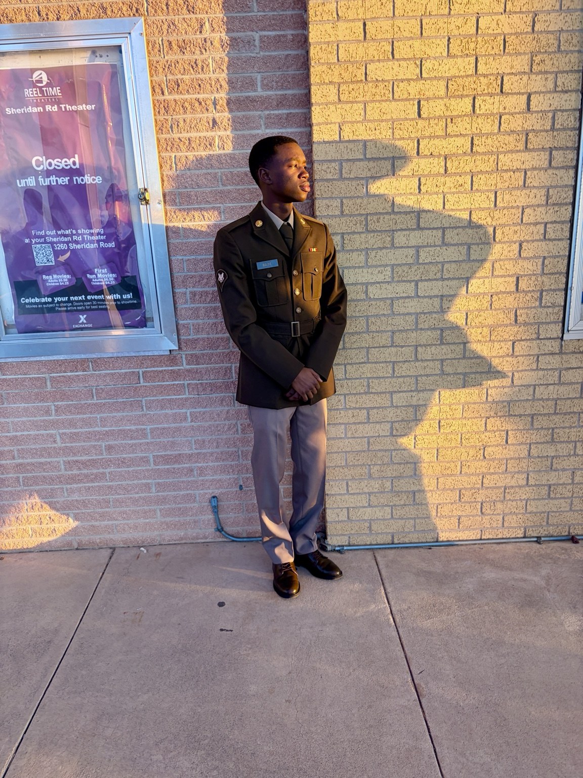 SPC Wagne in Army dress uniform in the afternoon sun